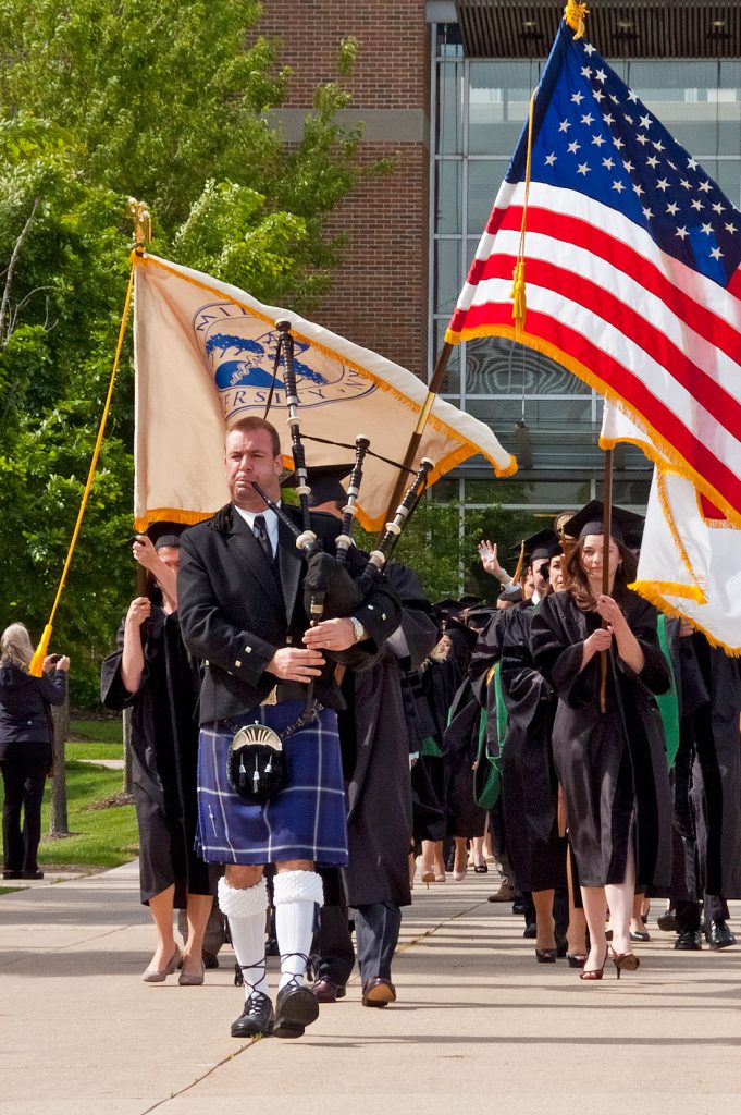 Bagpiper Leads Graduation Procession
