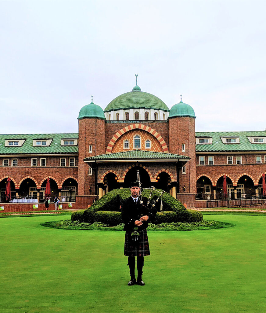 playing bagpipes on golf course